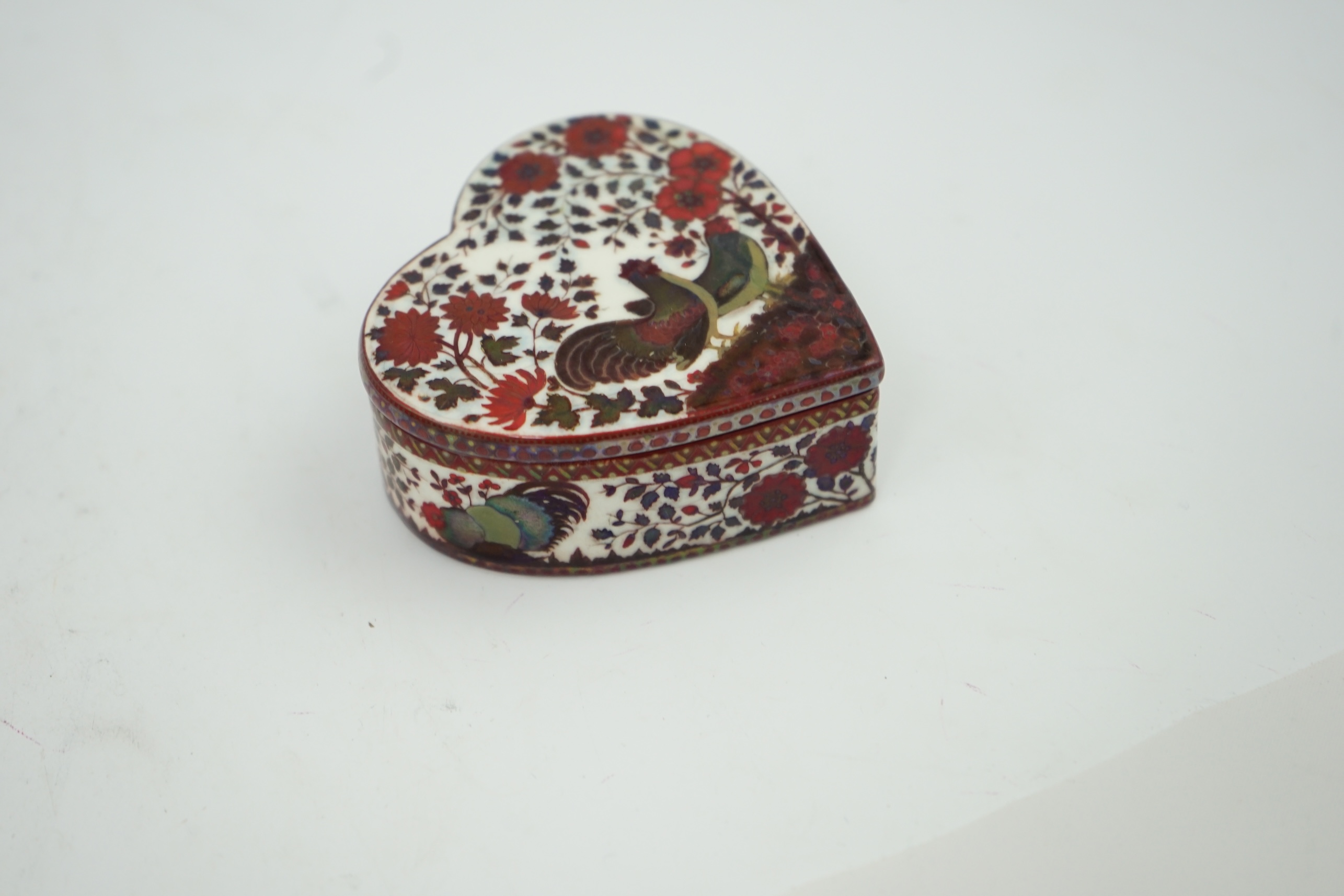 An early Zsolnay flambé lustre heart shaped box and cover, late 19th century